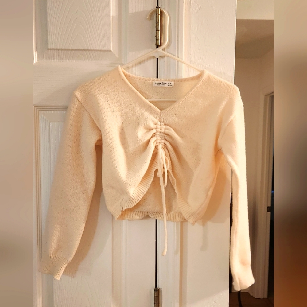 A cream string crop top